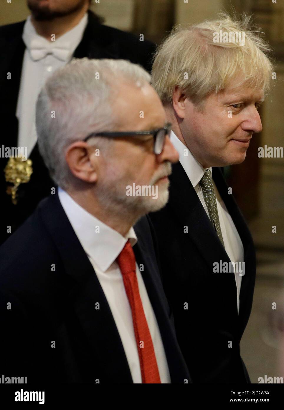 File photo dated 19/19/19 of Prime Minister Boris Johnson and the then opposition Labour Party Leader Jeremy Corbyn walk through the Members' Lobby in the House of Commons during the State Opening of Parliament by Queen Elizabeth II, at the Palace of Westminster in London. Boris Johnson will publicly announce his resignation later today, likely before lunchtime, the BBC is reporting. Issue date: Thursday July 7, 2022. Stock Photo