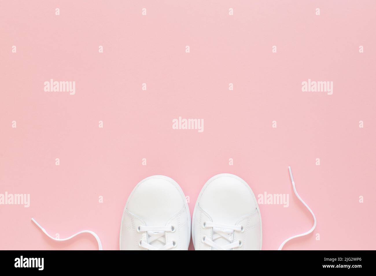 All white sneakers on pink background. Top view,flat lay Stock Photo ...
