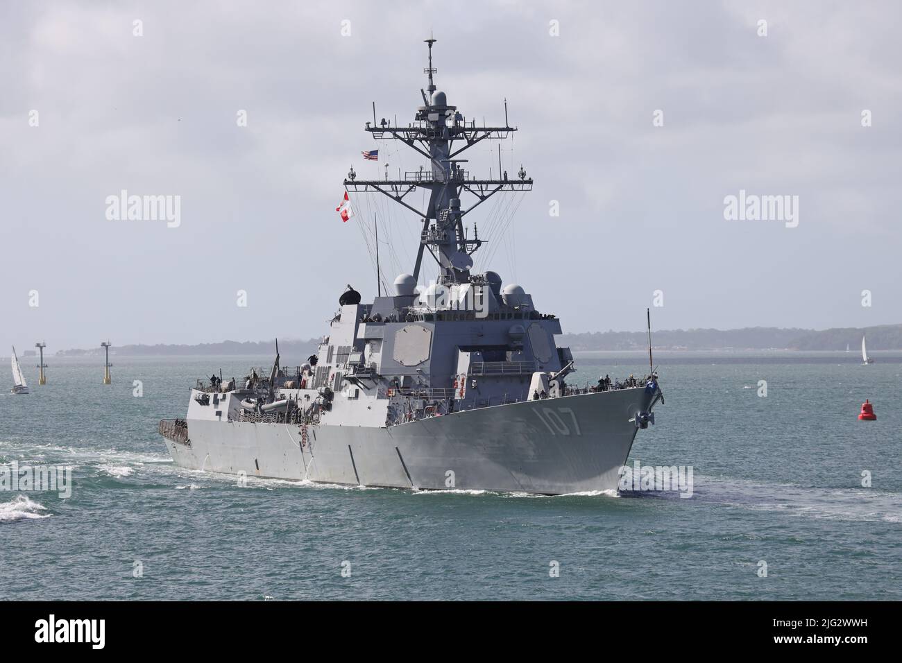 The US Navy Arleigh-Burke class guided missile destroyer USS GRAVELY (DDG-107) arriving at the Naval Base for a brief logistics stop Stock Photo