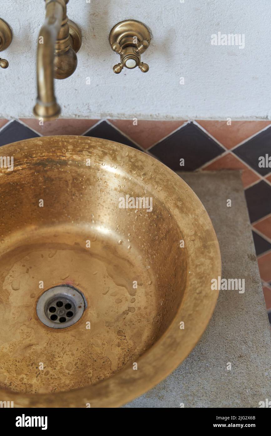 Gold sink and faucet in vintage style Stock Photo