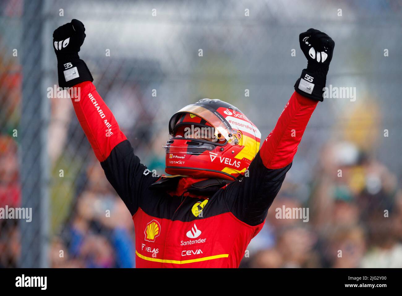 Carlos Sainz celebrates winning his first ever F1 Grand Prix standing on top of his car in Parc ferme at the F1 British Grand Prix. Carlos Sainz wins Stock Photo