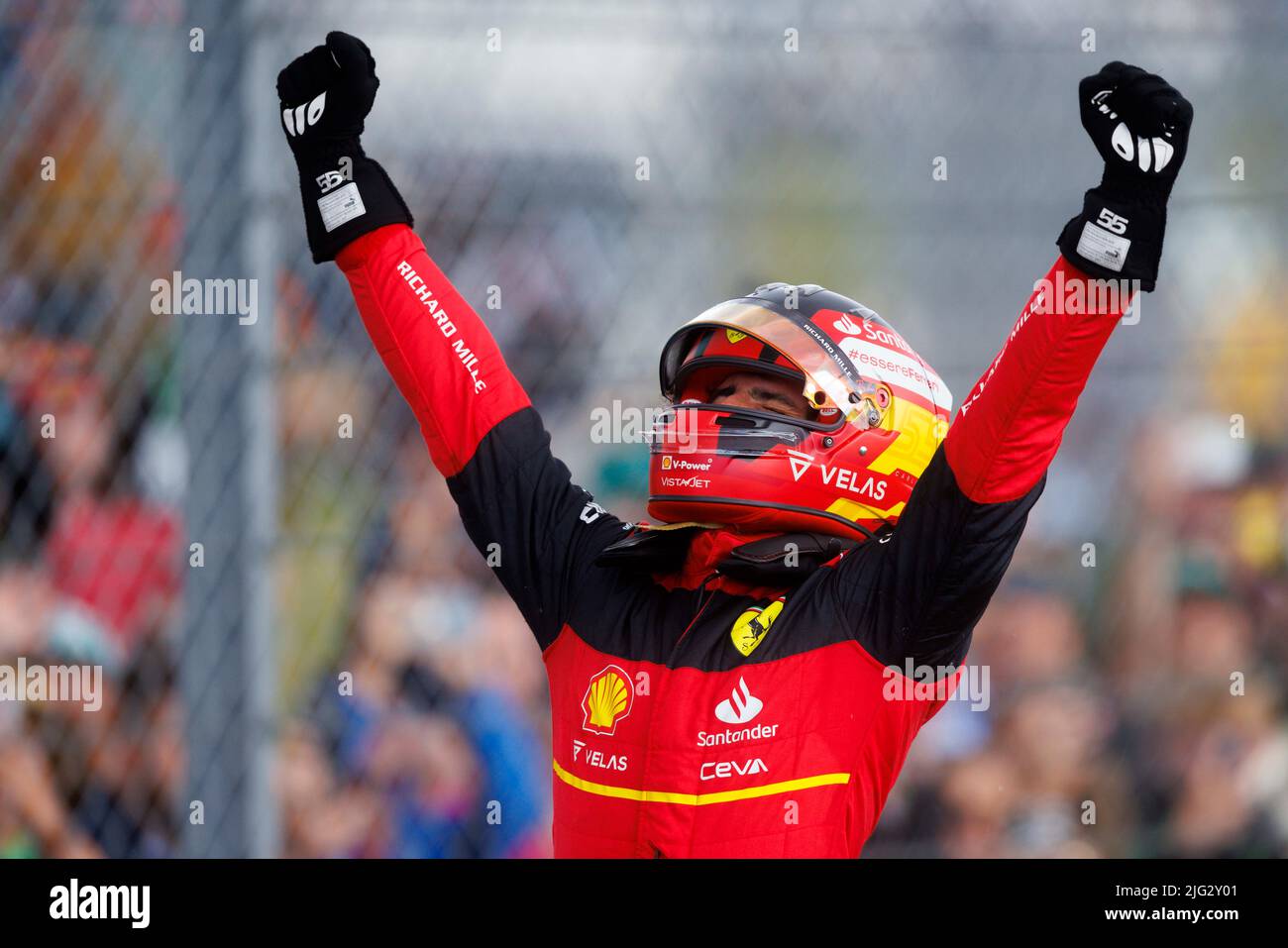 Carlos Sainz celebrates winning his first ever F1 Grand Prix standing on top of his car in Parc ferme at the F1 British Grand Prix. Carlos Sainz wins Stock Photo