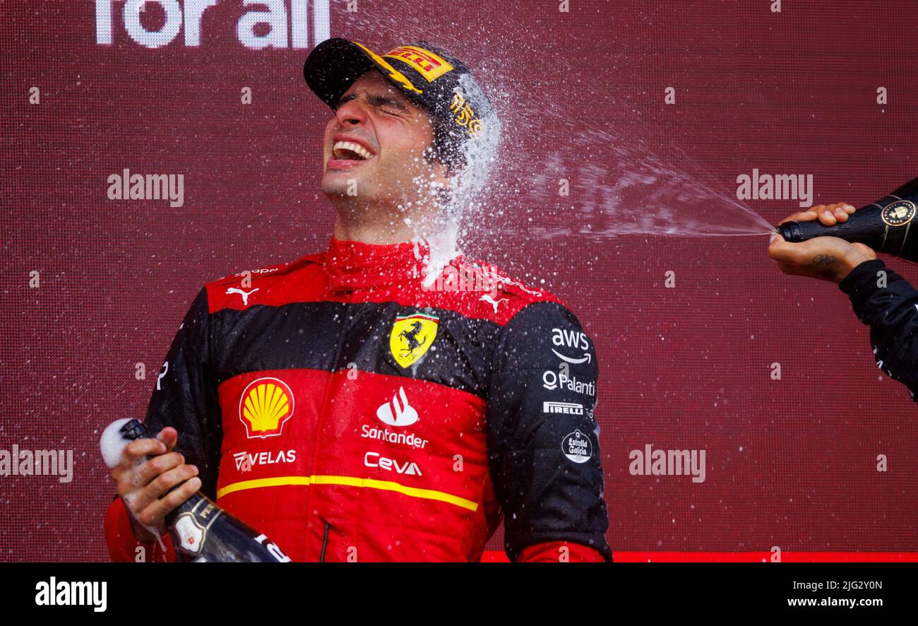 Carlos Sainz celebrates winning his first ever F1 Grand Prix on the podium at the F1 British Grand Prix. Carlos Sainz wins his first F1 race at the Br Stock Photo