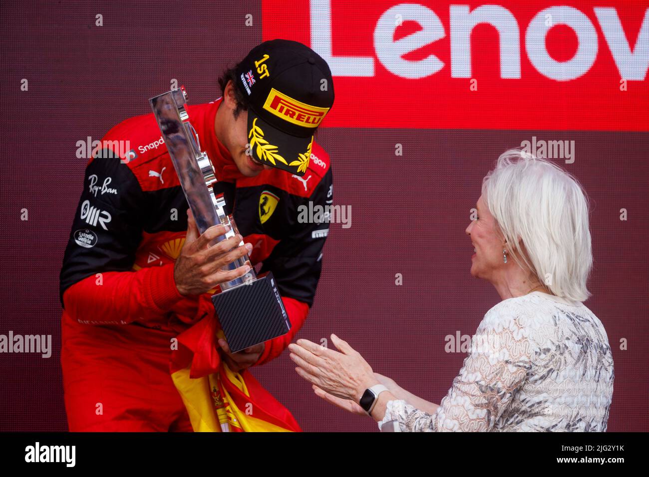 Carlos Sainz celebrates winning his first ever F1 Grand Prix as Nadine Dorries hands him the trophy on the podium at the F1 British Grand Prix. Carlos Stock Photo