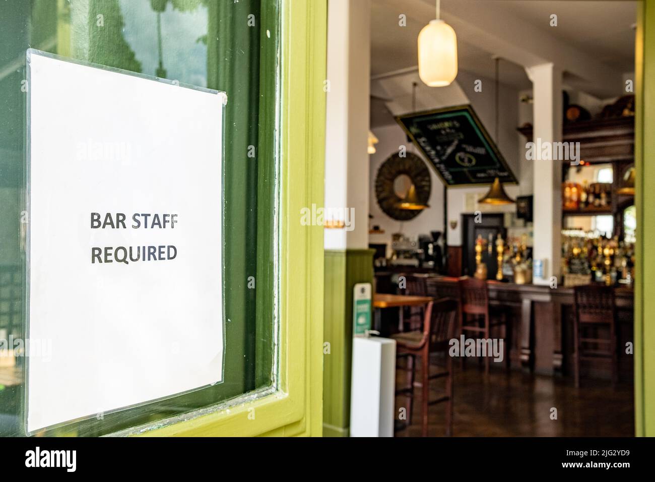 Job advert for Bar Staff on entrance of British public house Stock Photo