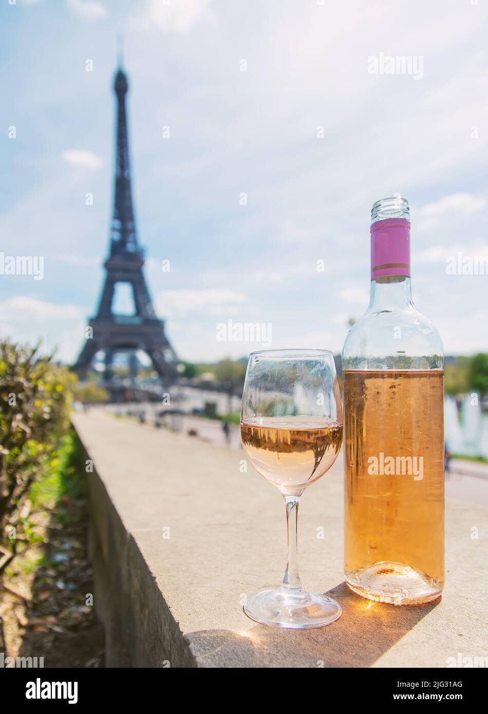 Wine in a glass near the eiffel tower. Selective focus. Nature. Stock Photo