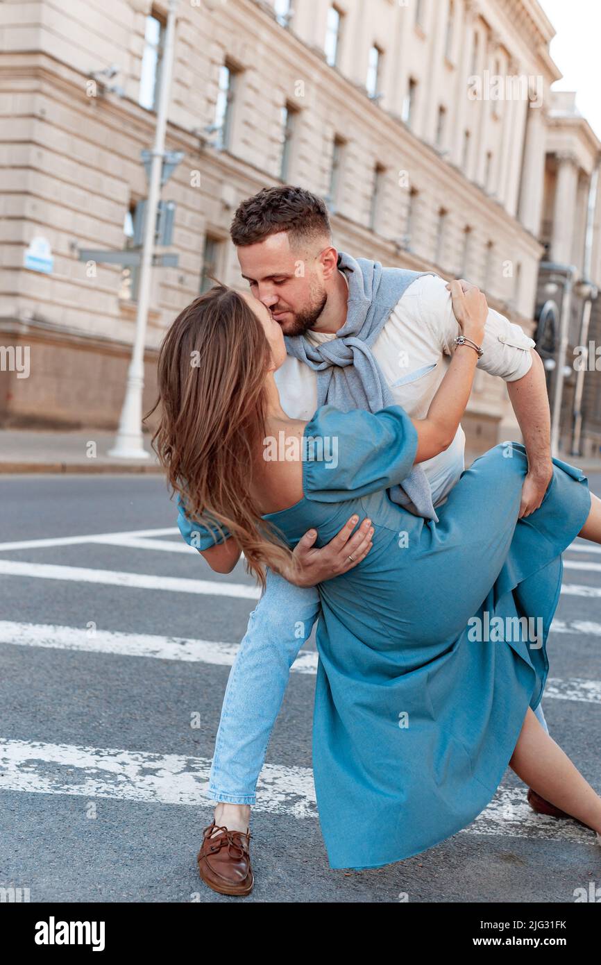 Romantic couple dancing in the street on a sunny summer day in city Stock Photo