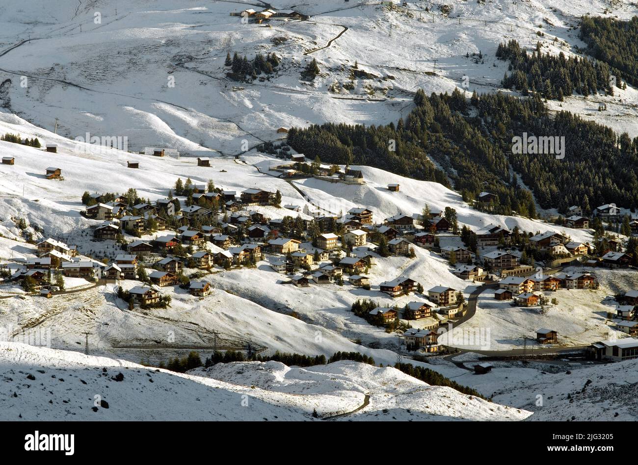 mountain village and ski resort in snowy mountain scenery, Switzerland, Arosa Stock Photo