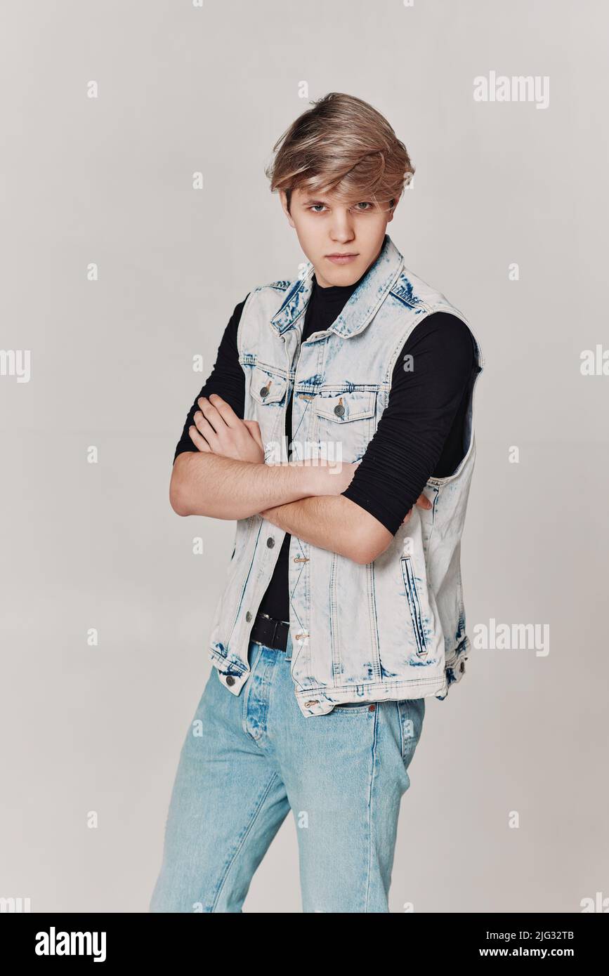 young handsome guy with modern haircut in denim Stock Photo