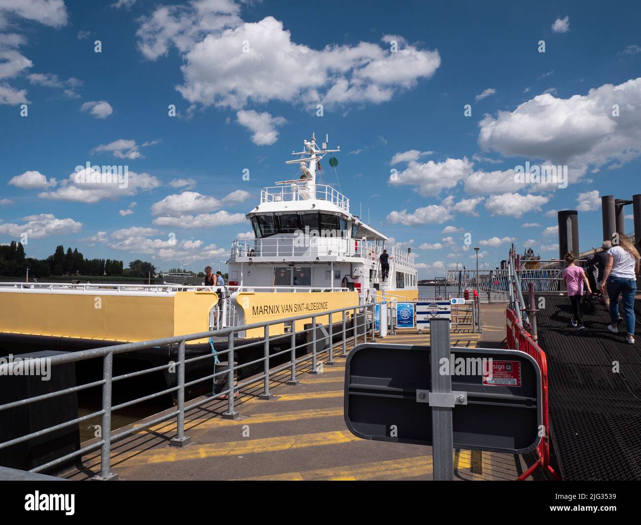 Antwerp, Belgium, July 02, 2022, People disembark from the ferry boat that takes people from the left bank to the right bank in Antwerp Stock Photo