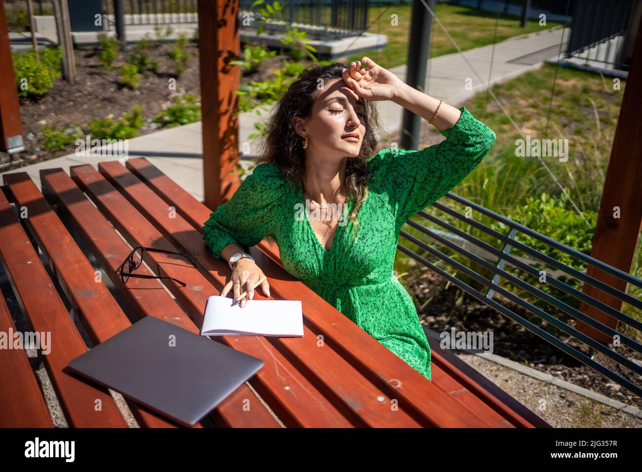 Caucasian woman drawing ideas on a notebook outside office Stock Photo ...