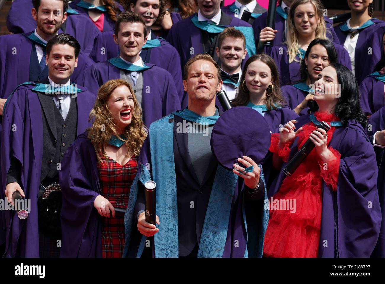 Outlander actor Sam Heughan with his honorary doctorate alongside other graduates from the Royal Conservatoire of Scotland in Glasgow. Picture date: Thursday July 7, 2022. Stock Photo