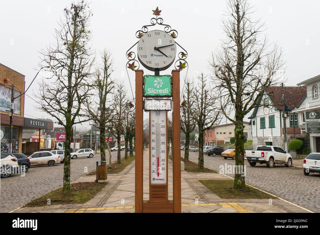 Sao Francisco de Paula, Brazil - Circa June 2022: Clock and thermometer at Julio de Castilhos Avenue in late Autumn Stock Photo