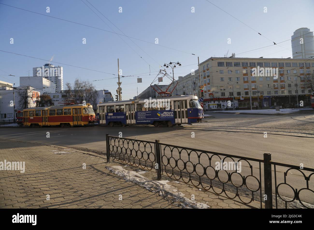 Colorful Russian trams on the streets of Ekaterinburg in Russia, on a sunny winter day Stock Photo