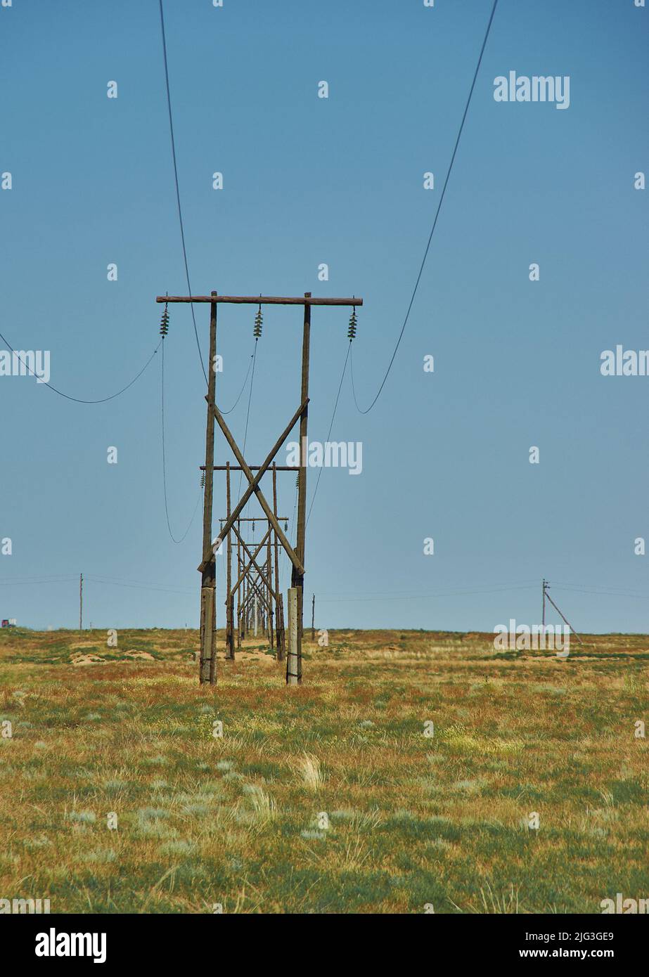 Overhead electric line in desert Republic of Kalmykia, Russia Stock Photo