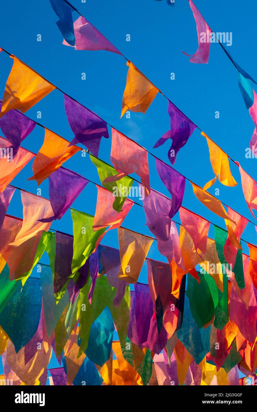 festa junina decoration - colorful backlit flags Stock Photo