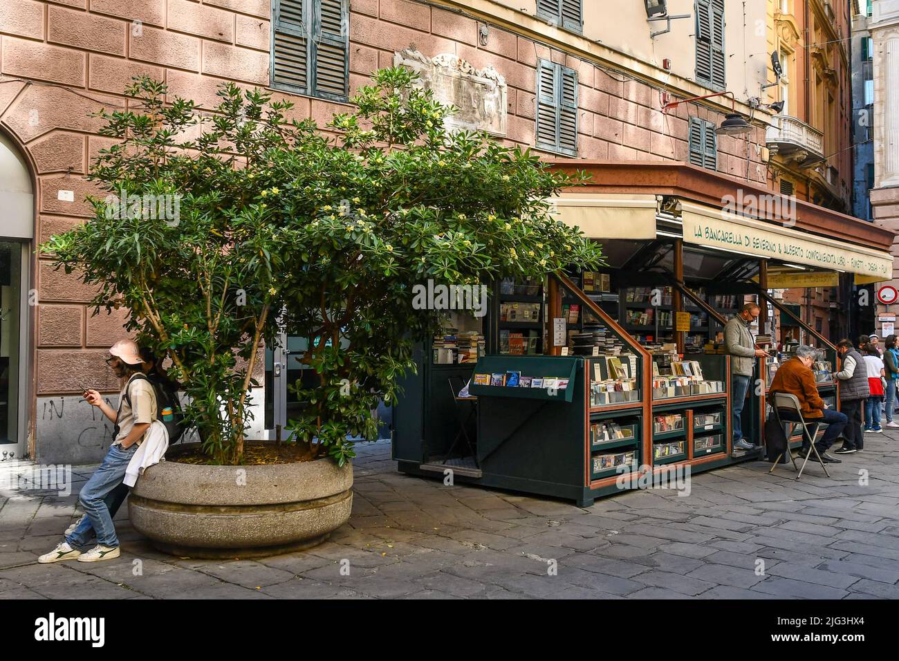A second-hand book stall in Piazza Banchi square in the historic centre of Genoa, Liguria, Italy Stock Photo