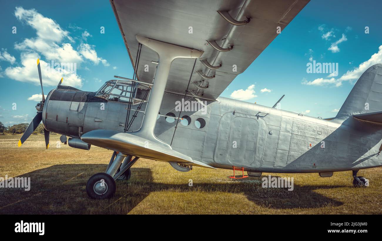 historical aircraft on a meadow Stock Photo