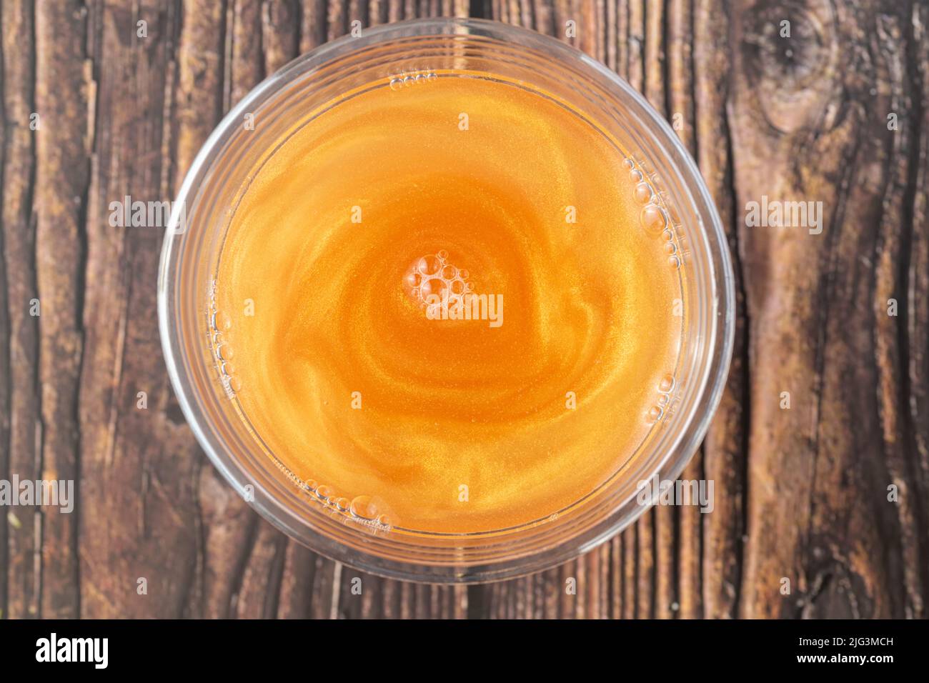 Cold icy drink with golden edible glitter or shimmer powder Stock Photo