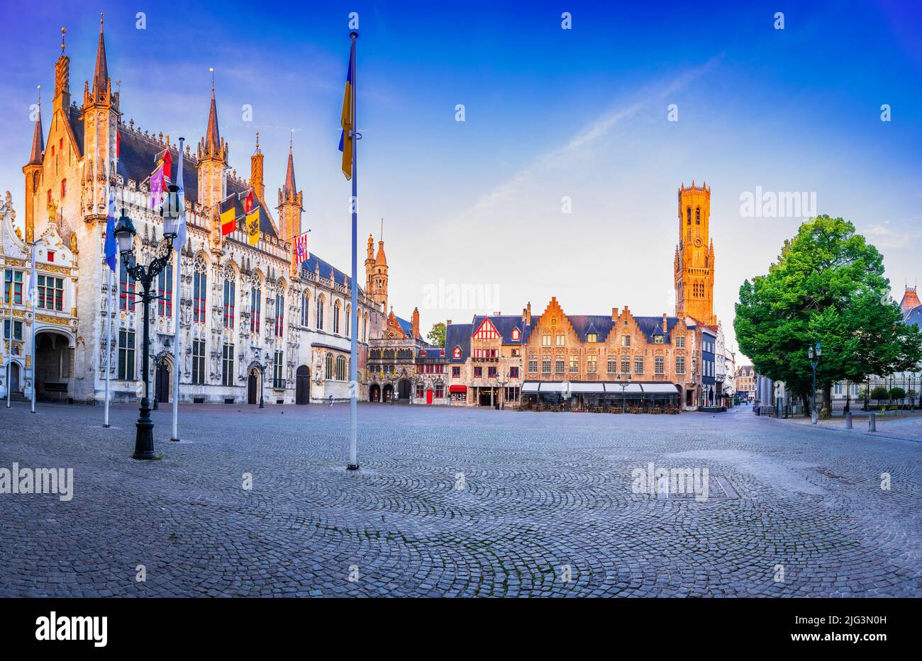 Bruges, Belgium. Panoramic Burg Square with famous Belfry tower and medieval buildings, Flanders sight. Stock Photo