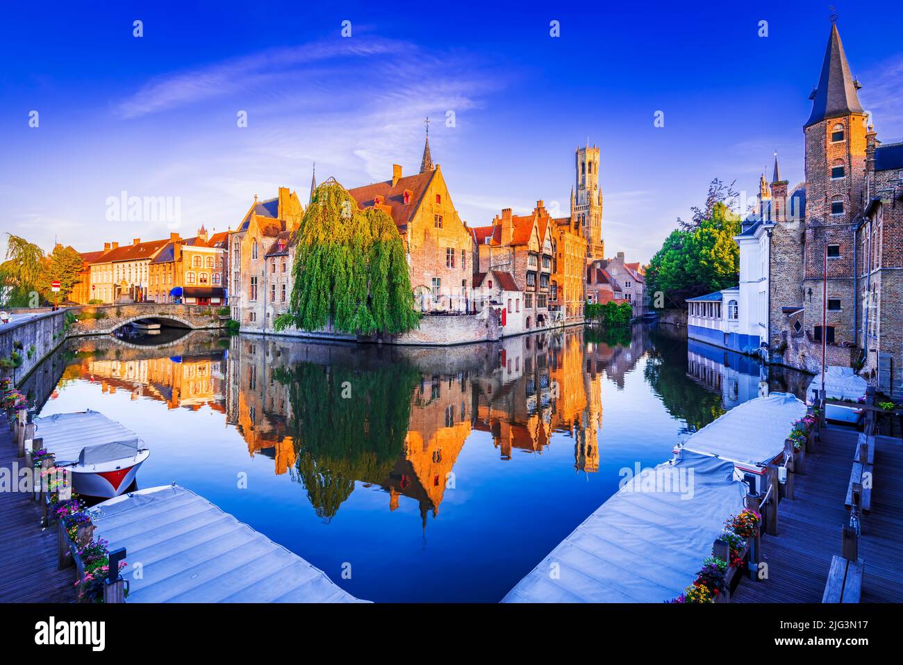 Bruges, Belgium. Golden hour landscape with beautiful Rozenhoedkaai in Brugge, famous Flanders
