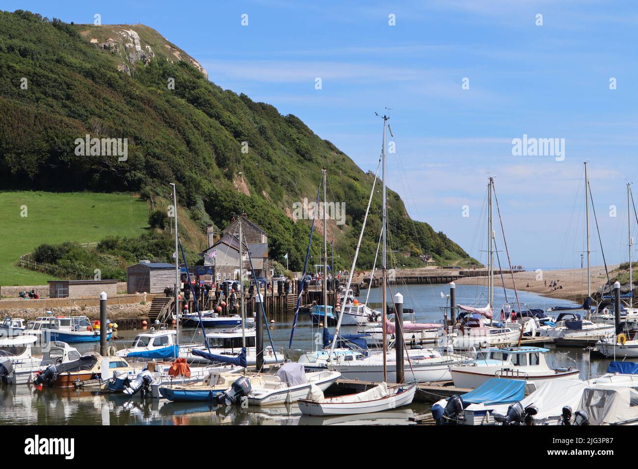 AXMOUTH, DEVON,ENGLAND - JULY 12TH 2020: Yachts and other boats in the marina at Axmouth on a beautiful sunny summers day Stock Photo