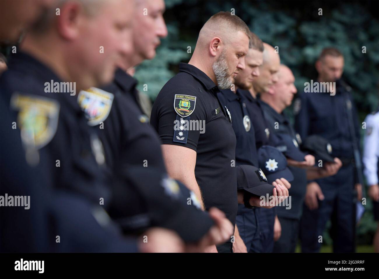 Kyiv, Ukraine. 04 July, 2022. Ukrainian National Police stand for a moment of silence during an event celebrating the 7th anniversary of the national police force hosted by President Volodymyr Zelenskyy,, July 4, 2022 in Kyiv, Ukraine.  Credit: Ukraine Presidency/Ukrainian Presidential Press Office/Alamy Live News Stock Photo