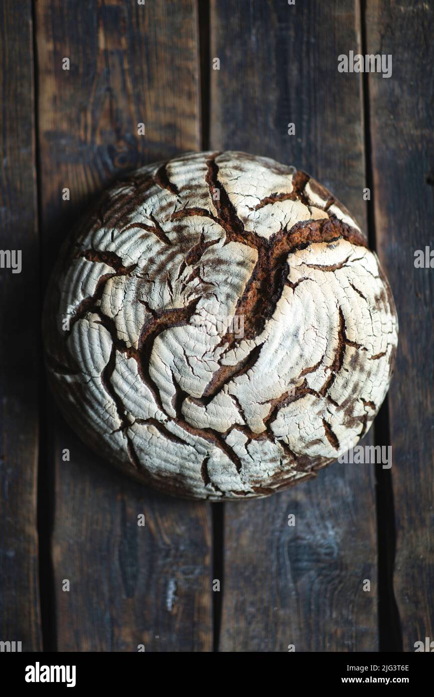 Textured rye bread om wood background Stock Photo