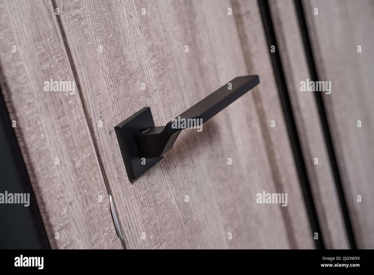 modern and secured metal closed door handle detail Stock Photo Alamy