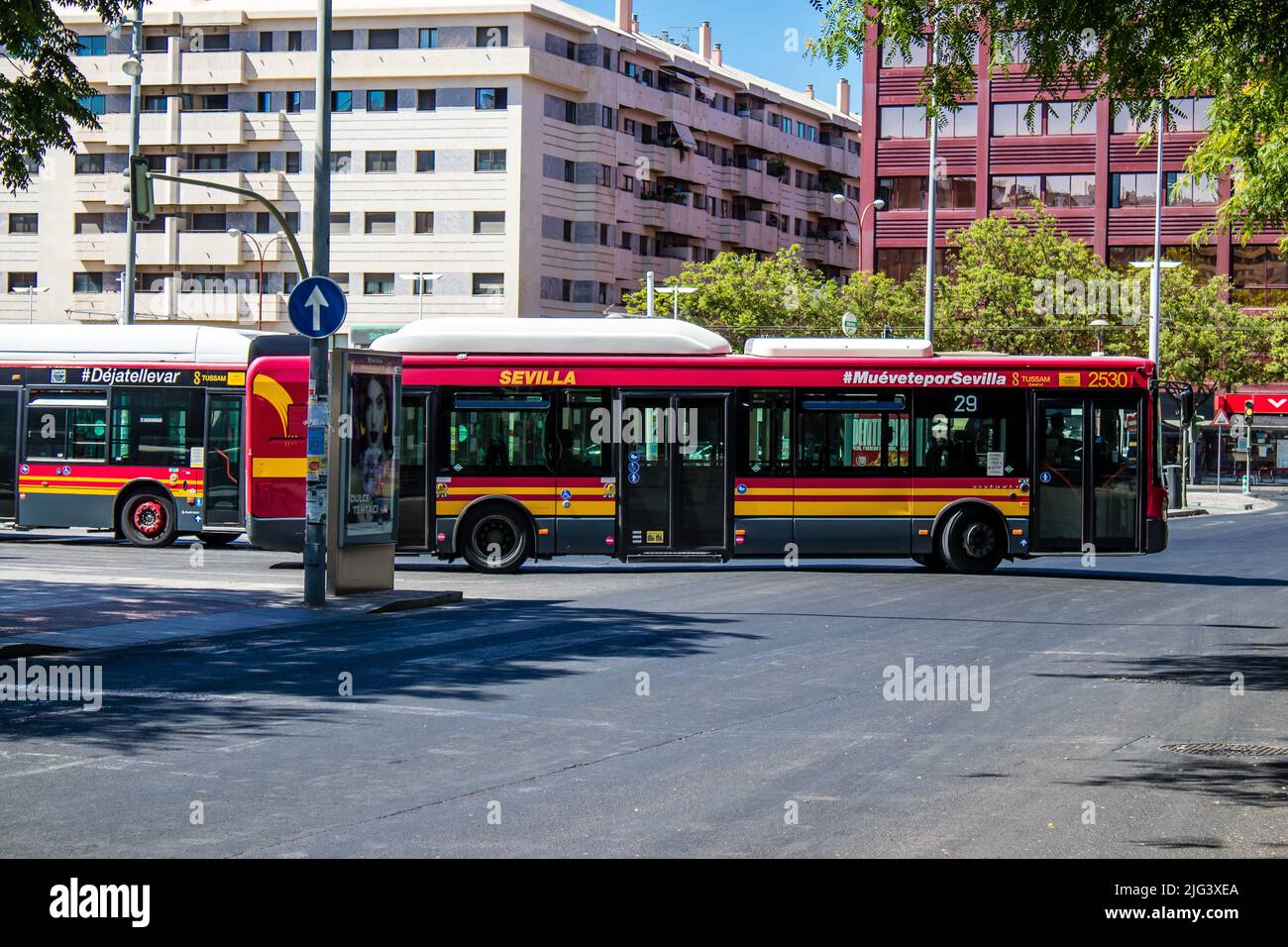 Seville, Spain July 04, 2022 Bus driving through the streets of