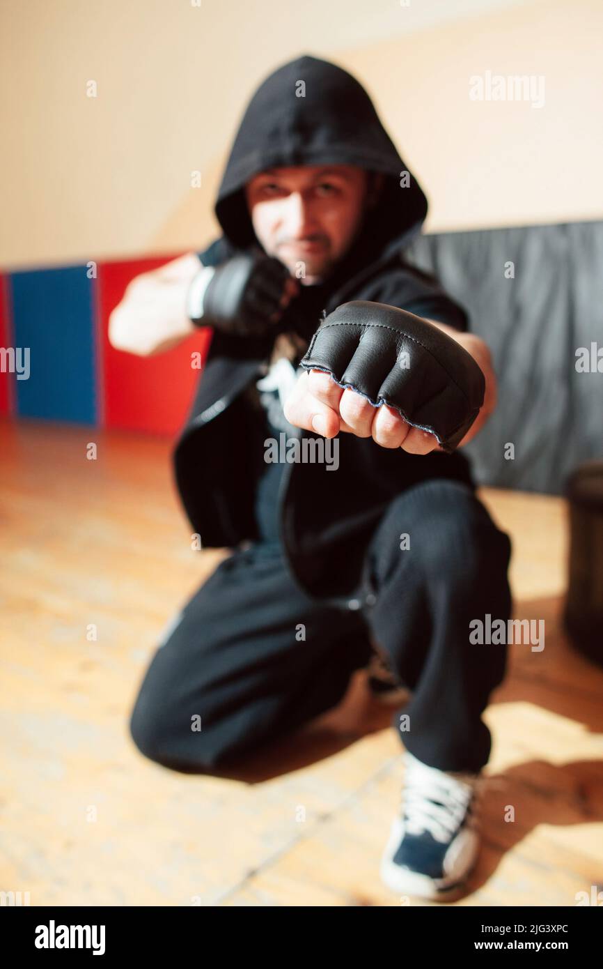 Aggressive street fighter shows his fist Stock Photo - Alamy