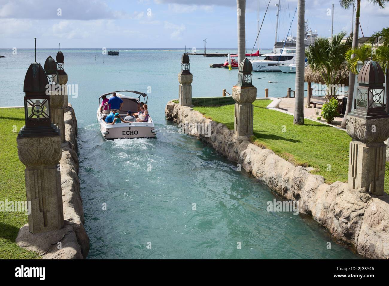 ORANJESTAD, ARUBA - DECEMBER 4, 2021: Water taxi to the private Renaissance island leaving the hotel of Renaissance Aruba Resort & Casino Stock Photo