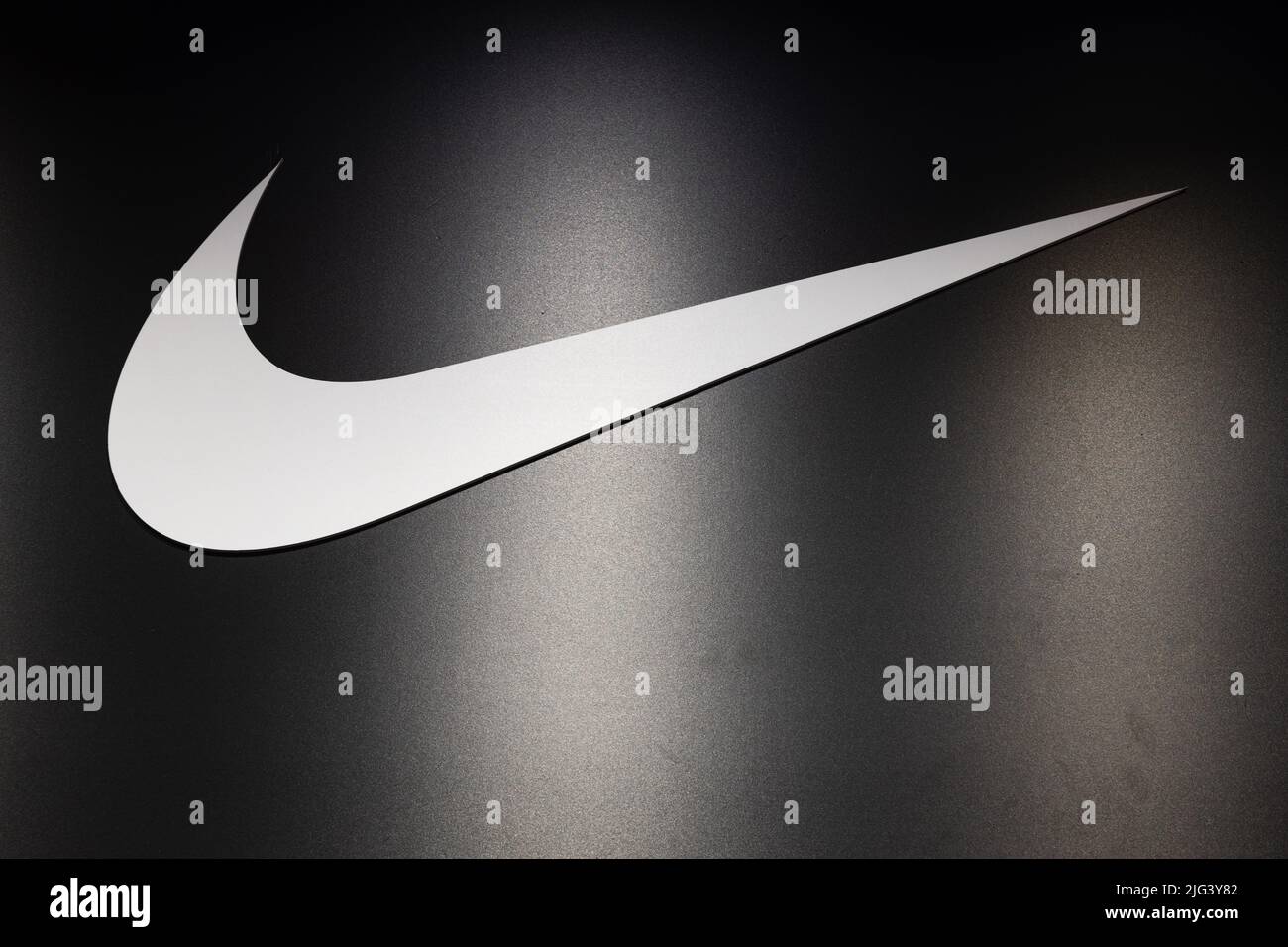 Logotype logo sign of Nike on the wall of the store. Kaunas, Lithuania, 22 June 2022 Stock Photo