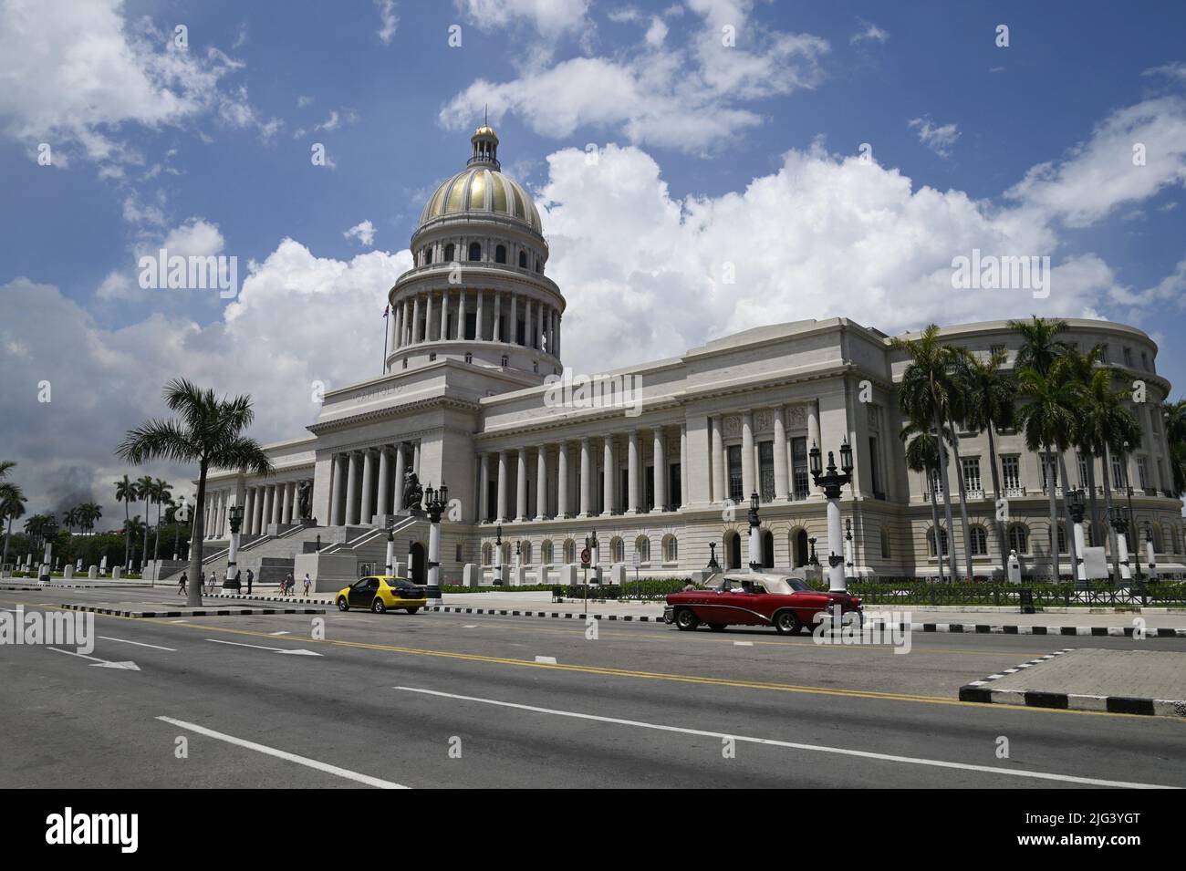 Vintage car front of El Capitolio, the emblematic National Capitol building in the historic center of Havana, Cuba. Stock Photo