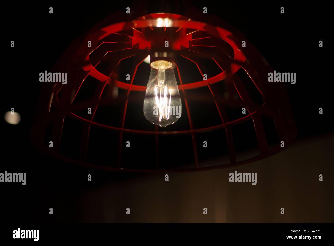 Incandescent lamp in interior. Rim around lamp. Light source in room