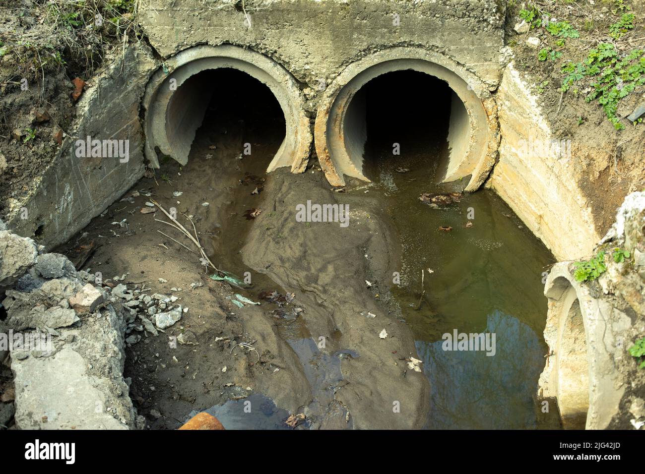 Pipes drain waste. Sewerage in city. Concrete pipes in ground. Waste