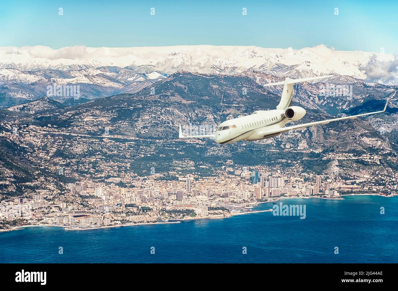 Private jet flying over Monaco Stock Photo