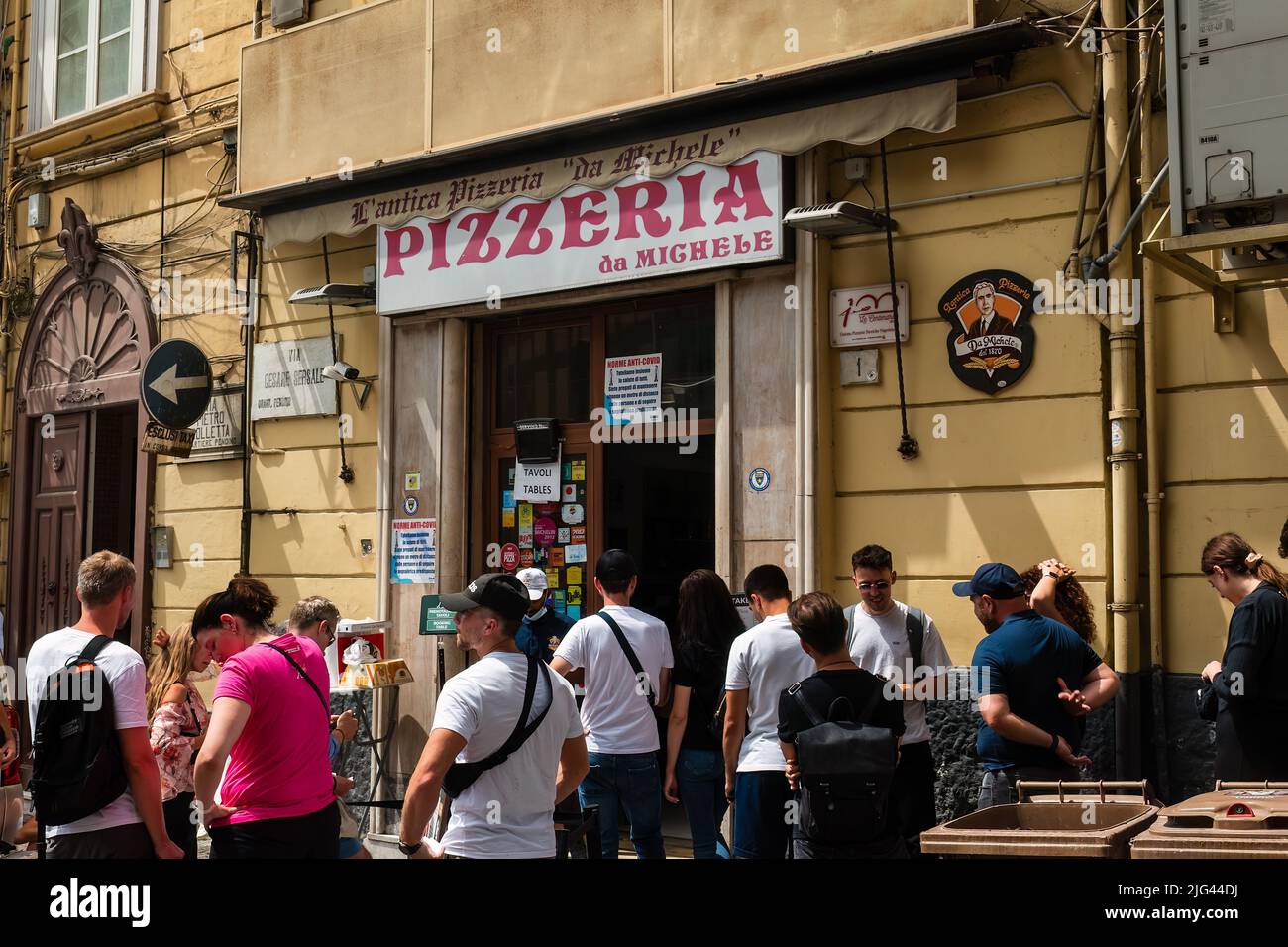 Naples, Italy. May 27, 2022. People waiting outside the famous L'antica Pizzeria da Michele in Naples, Italy. Stock Photo
