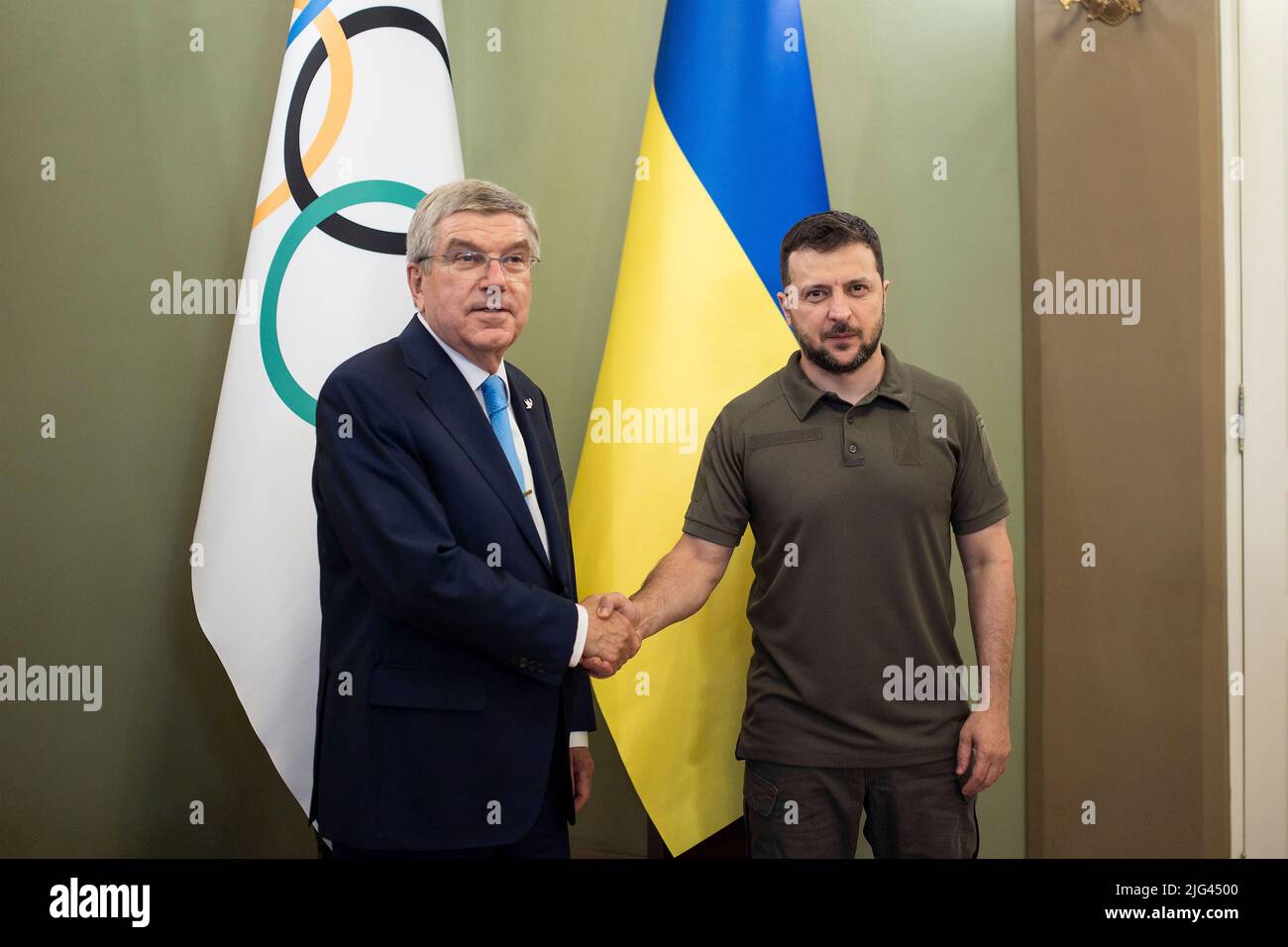 Kyiv, Ukraine. 03 July, 2022. Ukrainian President Volodymyr Zelenskyy, right, shakes hands with International Olympic Committee President Thomas Bach, left, prior to their face-to-face meetings at the Mariinskyi Palace, July 3, 2022 in Kyiv, Ukraine.  Credit: Ukraine Presidency/Ukrainian Presidential Press Office/Alamy Live News Stock Photo