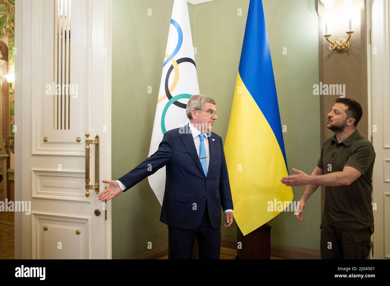 Kyiv, Ukraine. 03 July, 2022. International Olympic Committee President Thomas Bach, left, invites Ukrainian President Volodymyr Zelenskyy, to enter the room first during his visit to the Mariinskyi Palace, July 3, 2022 in Kyiv, Ukraine.  Credit: Ukraine Presidency/Ukrainian Presidential Press Office/Alamy Live News Stock Photo