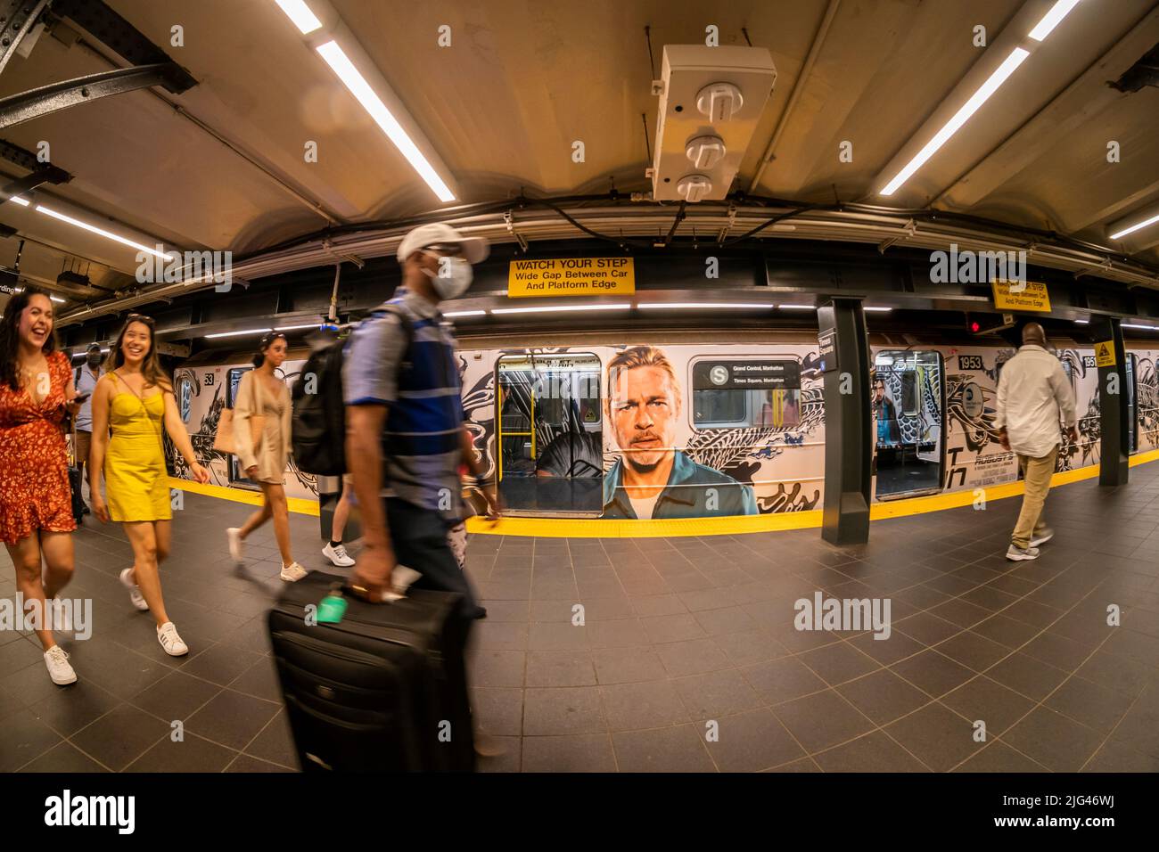The giant face of Brad Pitt greets commuters in a wrapped 42nd Street shuttle train in Times Square in New York on Saturday, July 2, 2022. The advertising is for the film Bullet Train starring Pitt, and Sandra Bullock among others with a release date of August 5. (© Richard B. Levine) Stock Photo