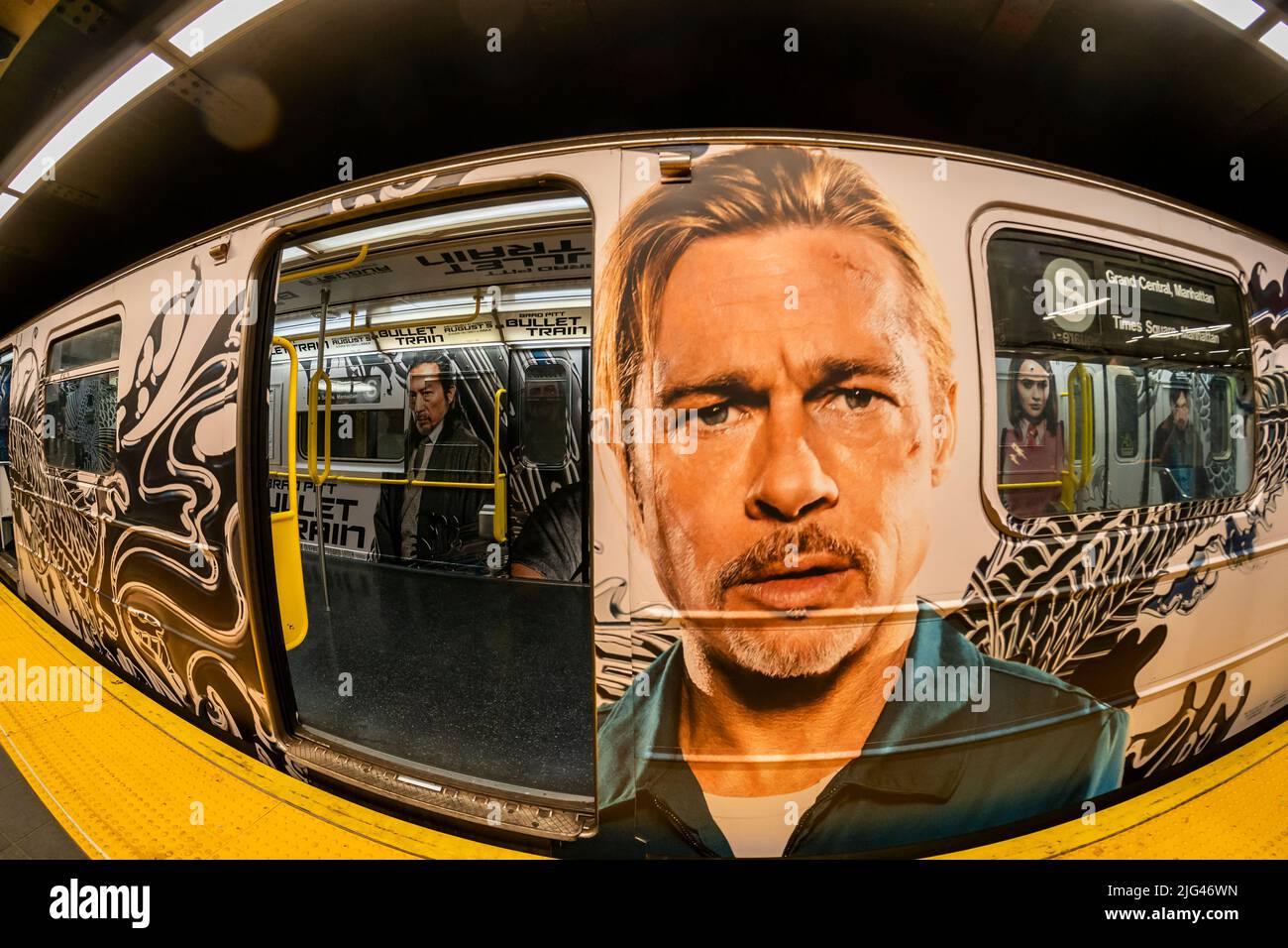 The giant face of Brad Pitt greets commuters in a wrapped 42nd Street shuttle train in Times Square in New York on Saturday, July 2, 2022. The advertising is for the film Bullet Train starring Pitt, and Sandra Bullock among others with a release date of August 5. (© Richard B. Levine) Stock Photo