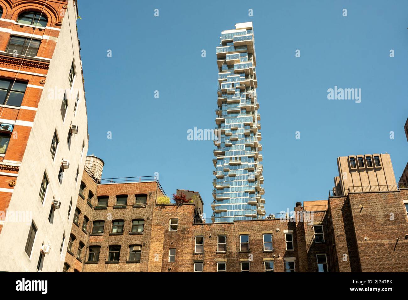 The condo skyscraper at 56 Leonard Street looms over lower Tribeca buildings in New York on Sunday, July 3, 2022. 56 Leonard Street, designed by Herzog & de Meuron is 820 feet high with 145 apartments. (© Richard B. Levine) Stock Photo