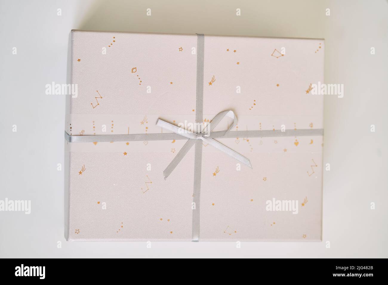 Light gift box with a bow close up Stock Photo Alamy