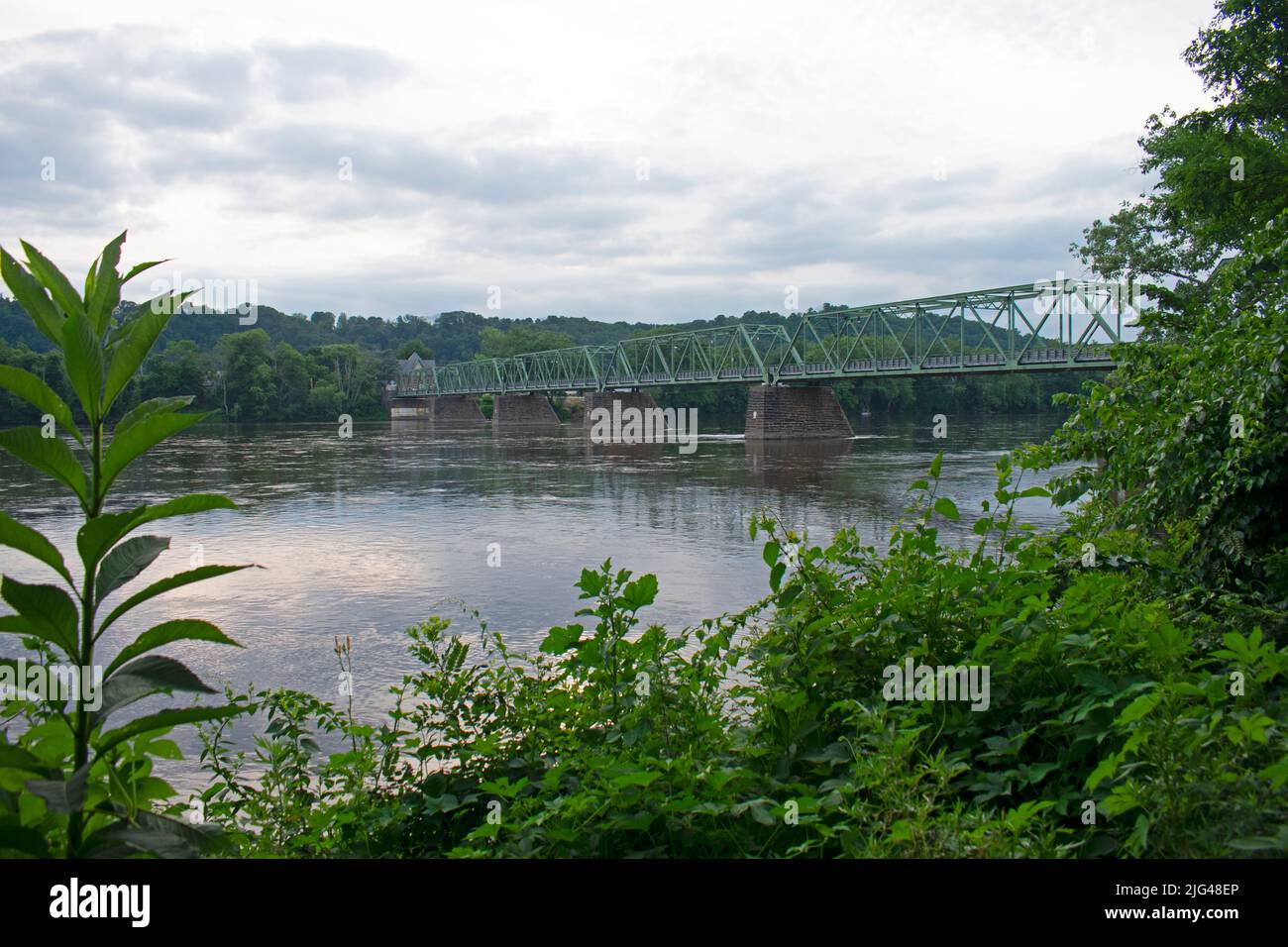 Narrow metal truss bridge crossing the Delaware River between the towns of Frenchtown, New Jersey, and Uhlerstown, Pennsylvania -02 Stock Photo