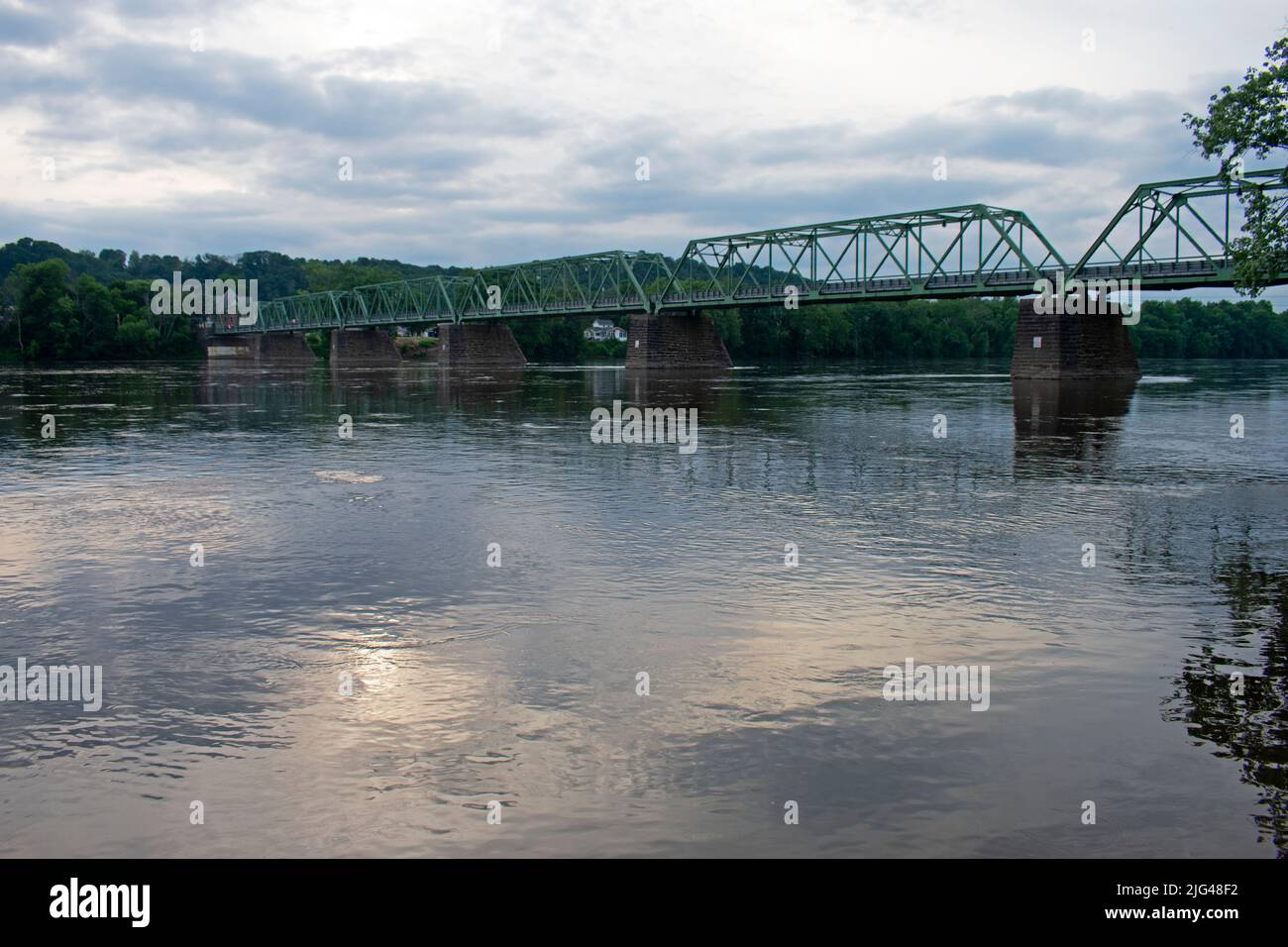 Narrow metal truss bridge crossing the Delaware River between the towns of Frenchtown, New Jersey, and Uhlerstown, Pennsylvania -03 Stock Photo