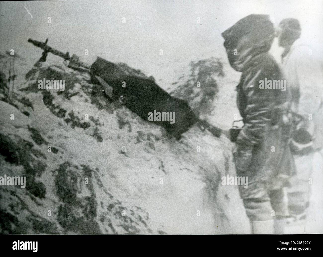 Shooting position of a light machine gun mg34. Shooting post of a light machine gun Mg 34, its mechanism is protected with a canvas against the cold of winter. Stock Photo