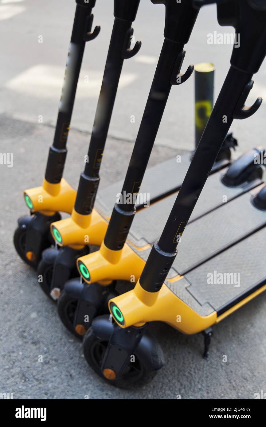 Electric scooters for rental . Vehicle rent service background. Electric kick scooters for transportation Stock Photo