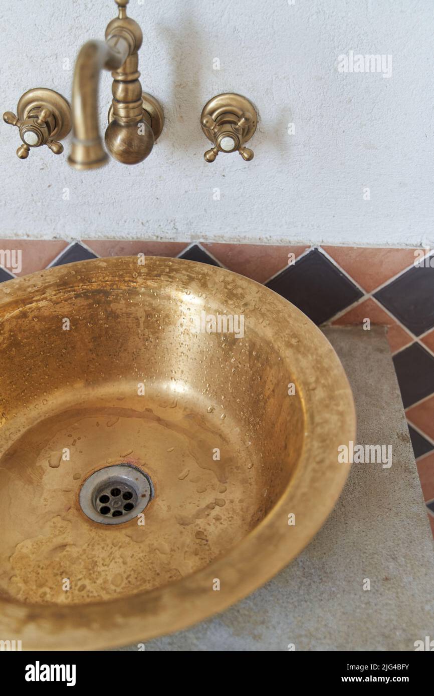 Gold sink and faucet in vintage style Stock Photo