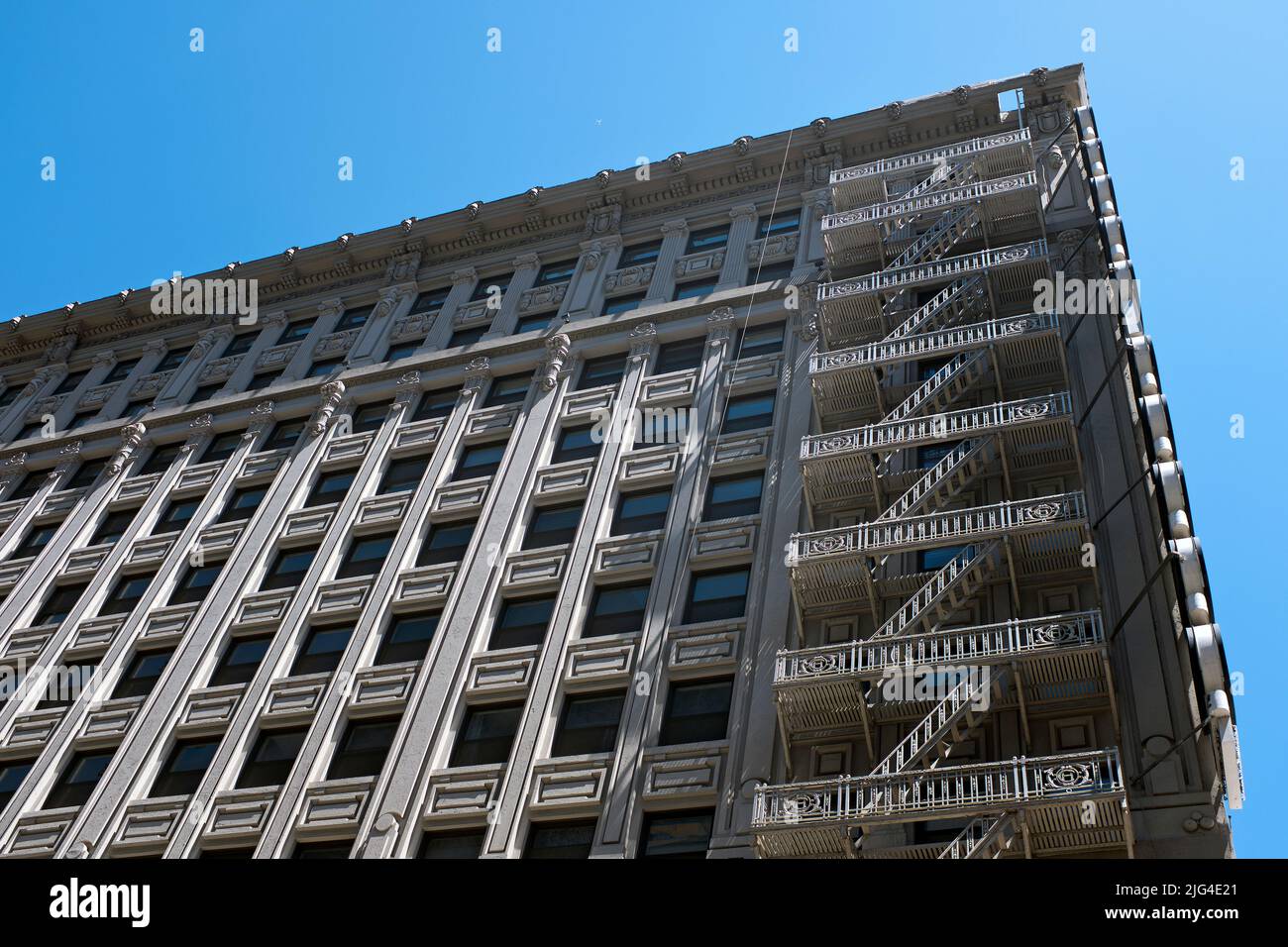Cast iron fire escape on corner of building, Low Angle View, Los Angeles, California, USA Stock Photo